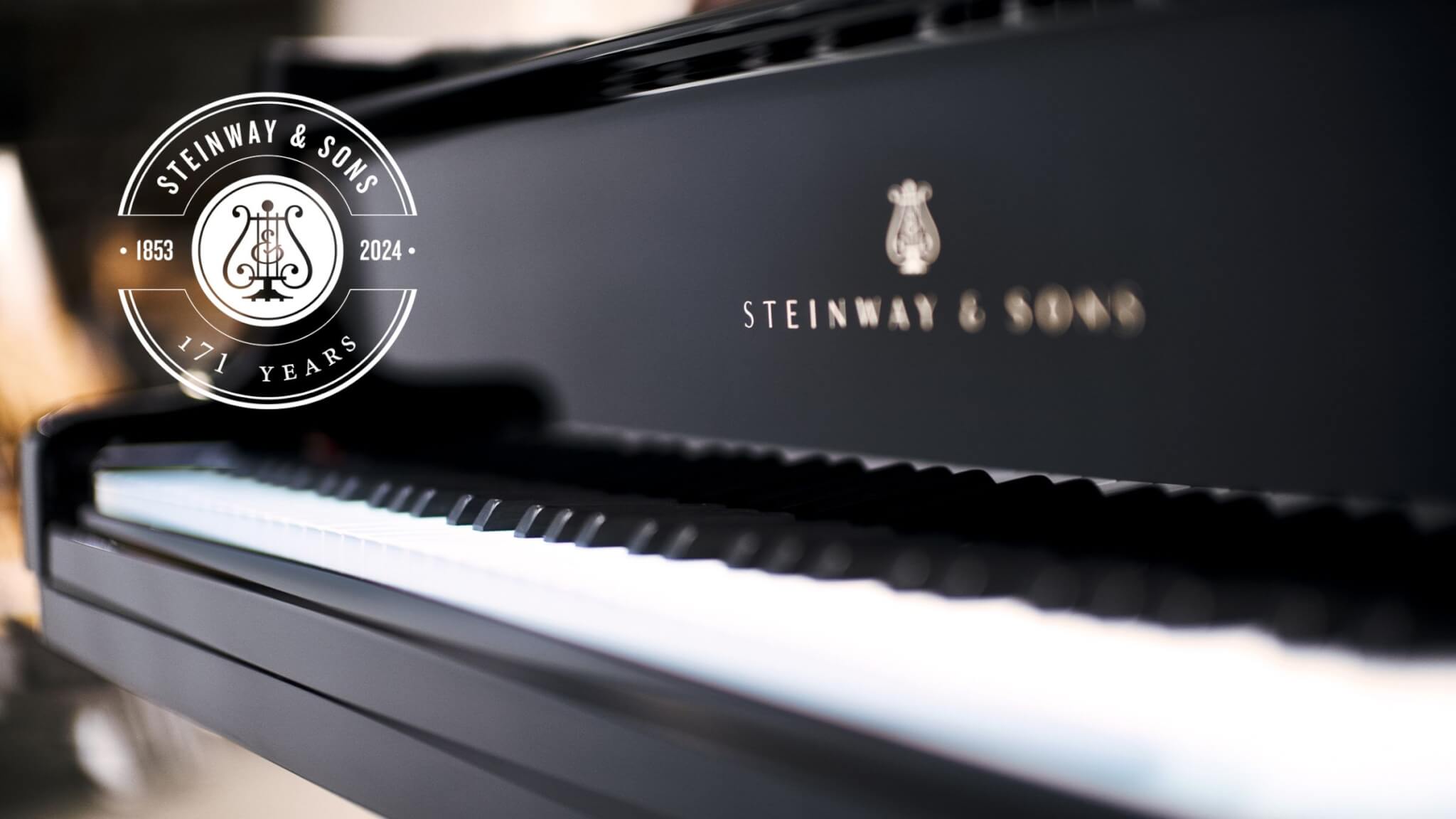 Image of Steinway piano with logo overlaid on top. The logo says 