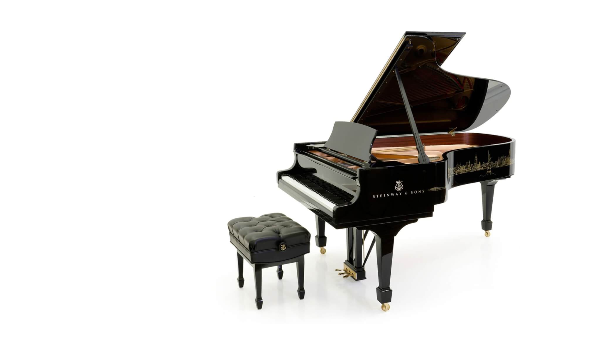 side shot of piano (with chair) showing the skyline design artwork