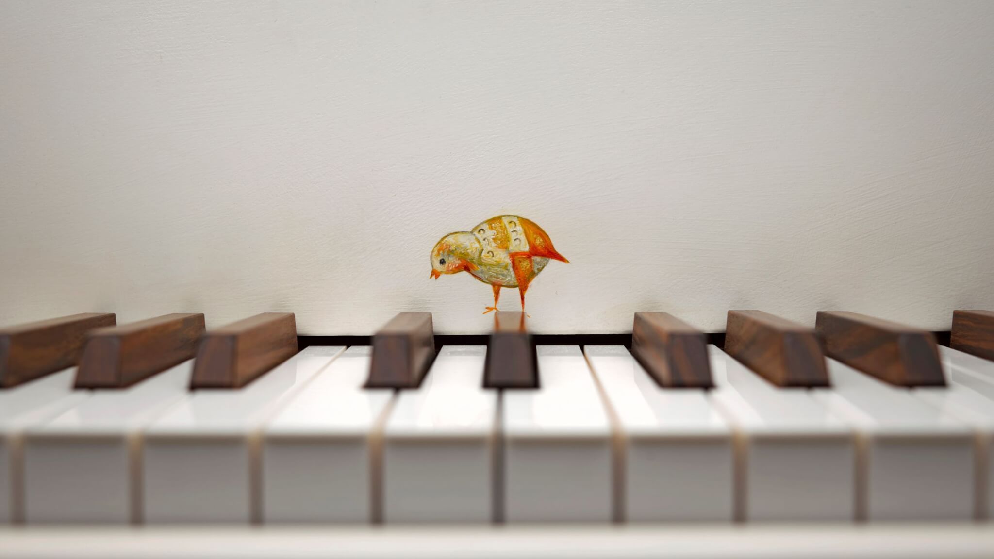 painting of bird on the piano